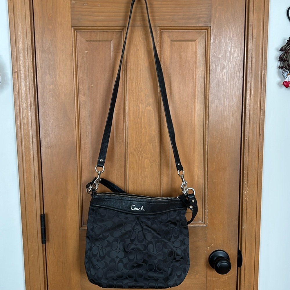 A very loved black coach bag